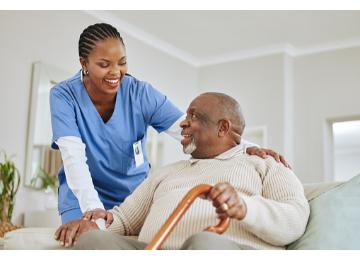 Nurse caring for elderly patient